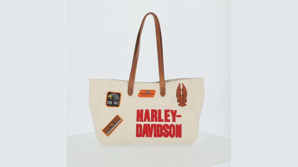 
                  
                    Load and play video in Gallery viewer, Harley-Davidson® Patches Canvas Summer Tote | Natural
                  
                